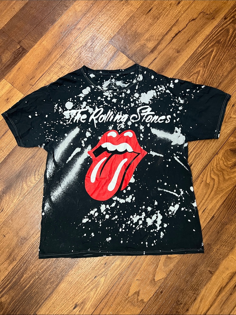 the Rolling Stones Black Kids Tee with Red Tongue and White Splatter